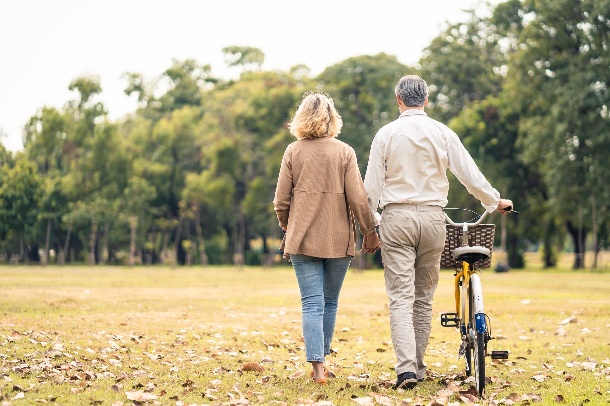 A retired couple out on a walk.