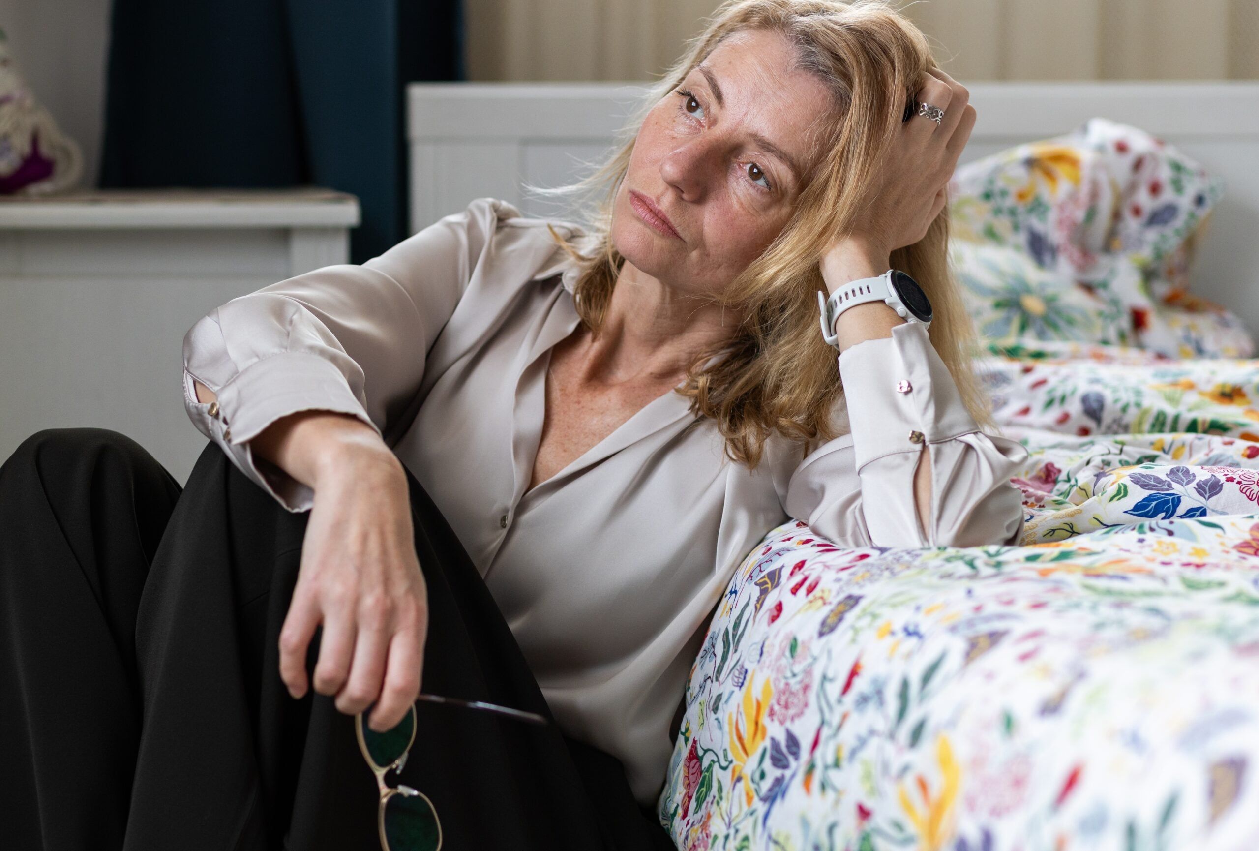 A lonely middle aged woman at home alone.