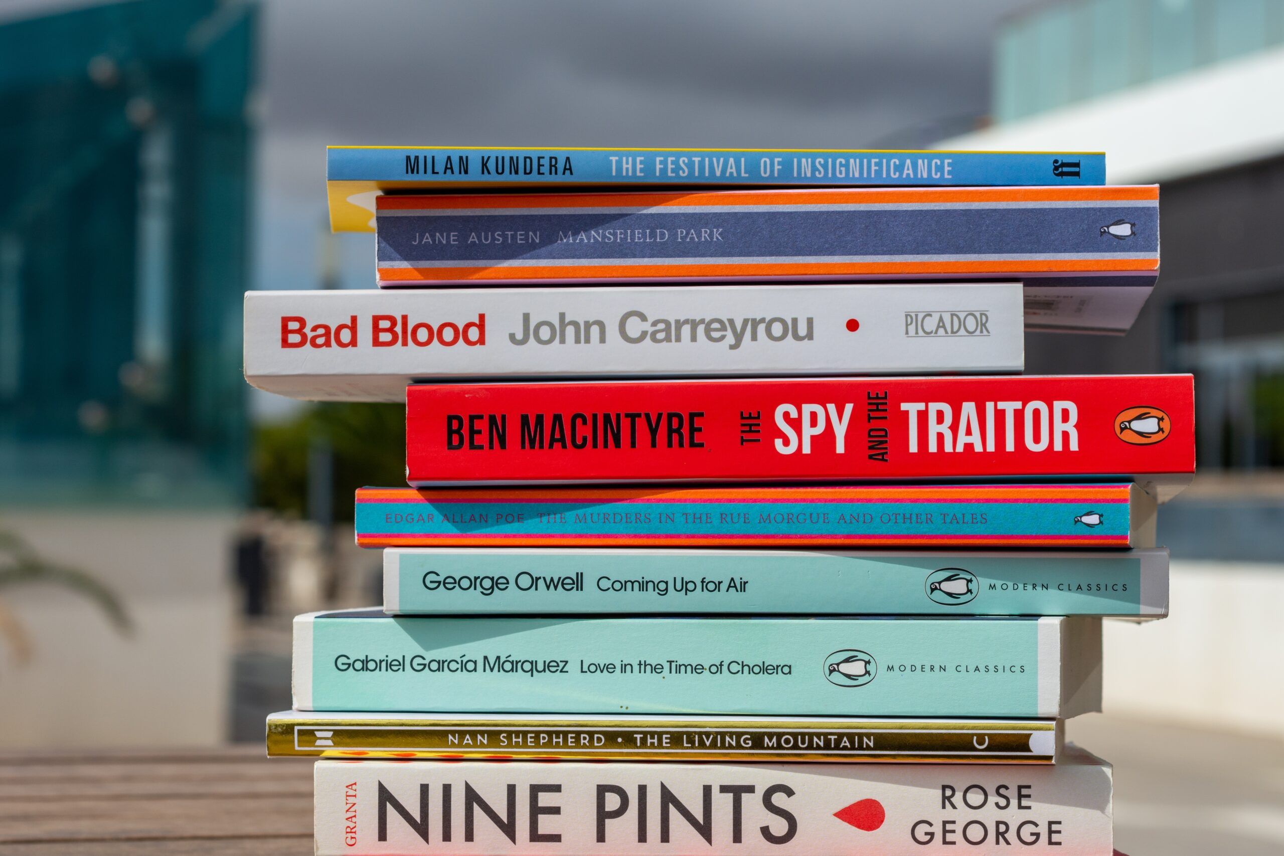 A stack of books being bought at the store.