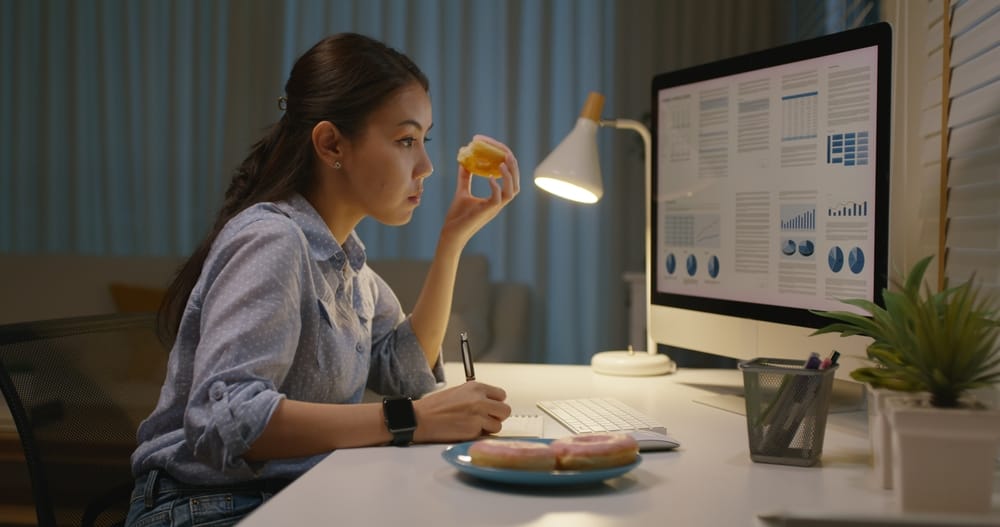A busy young woman working alone