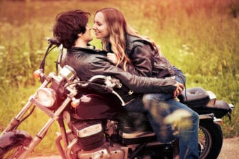 couple kissing motorcycle leather jacket