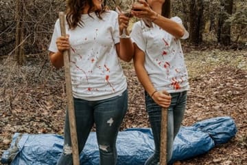 Best Friends Stage Horror-Themed Photoshoot Complete With Wine And A Dead Body