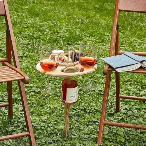 This Wine Table Holds Your Glasses, Bottle, And A Plate Full Of Snacks