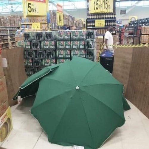 Supermarket Covers Dead Worker With Umbrellas For 4 Hours So It Can Stay Open