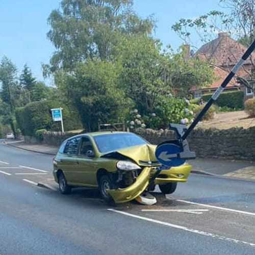 Driver Crashes Into Sign While Trying To Get Rid Of A Spider In His Car