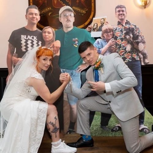 Couple Spends $2,500 On Cardboard Cutouts Of Friends So They Can ‘Attend’ Wedding