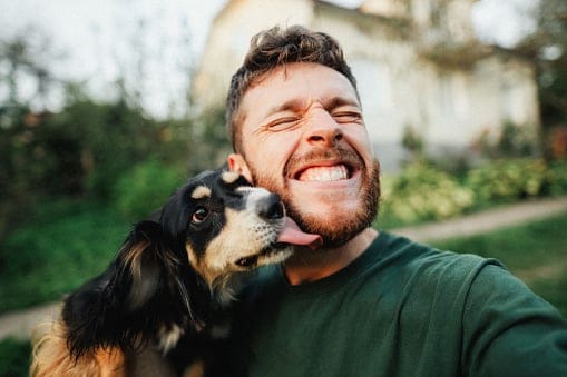 smiling bearded guy with his dog