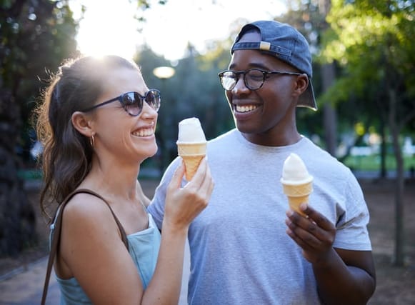 couple smiling and eating ice cream