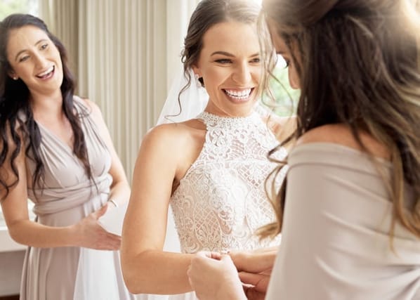 smiling bride with bridesmaids