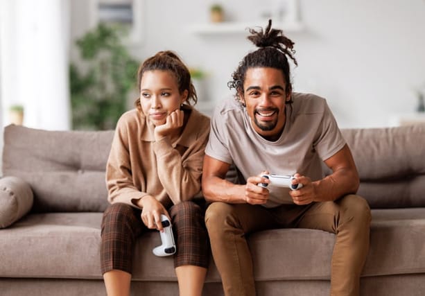 guy playing video games bored girlfriend