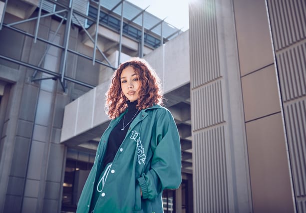 beautiful woman standing in city