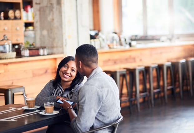 couple smiling on coffee date