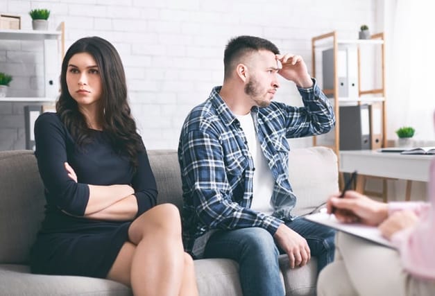 Family conflict. Offended spouses not talking to each other at marital therapy