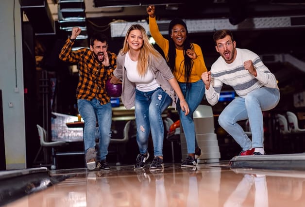 Group of friends bowling.