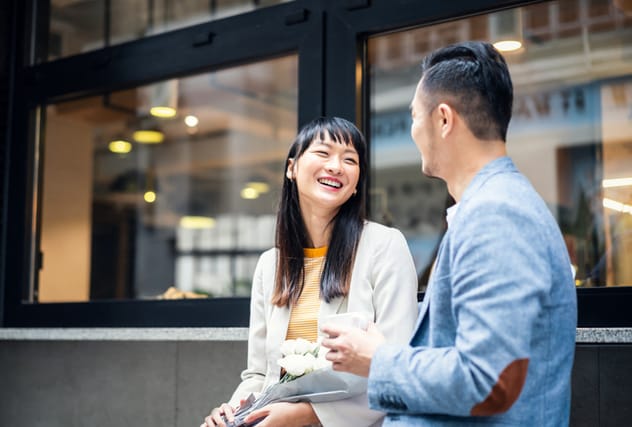 man and woman chatting over coffee