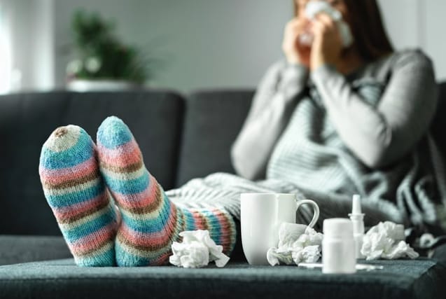 woman on the couch with a cold