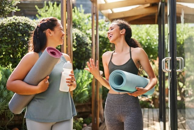 two women talking after yoga