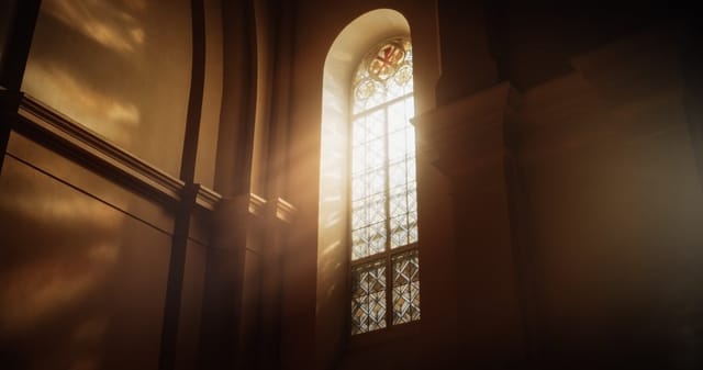 Sun rays streaming through stained glass window.