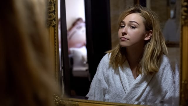 woman in robe in mirror