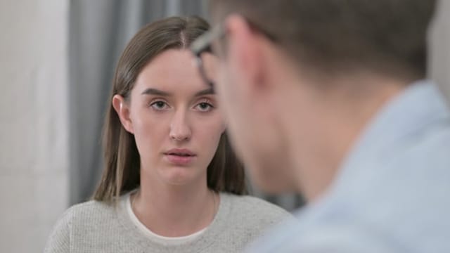 Close up of Upset Young Couple having Conversation