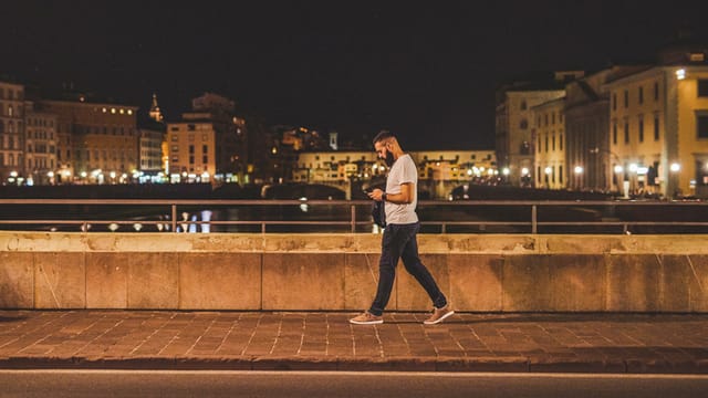 Full length shot of a handsome young man walking along the street