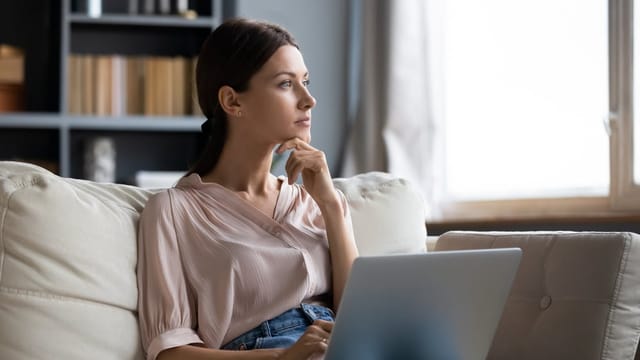 Woman at her desk doing work.
