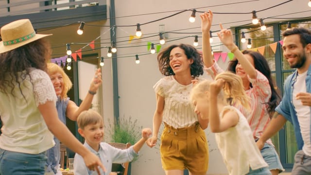 Family and friends dancing together.