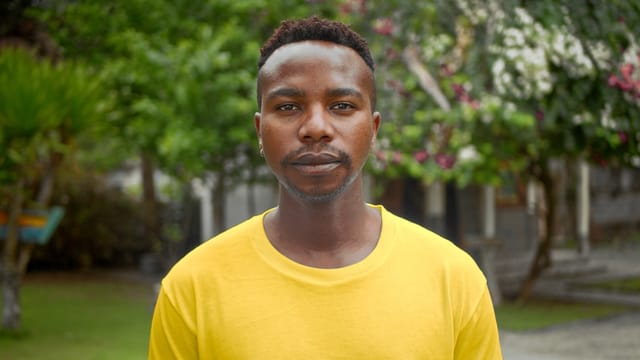 Young man walking outdoors.
