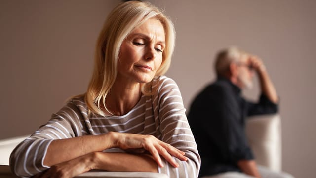 The older couple has a conflict. Upset mature woman, quarrel with her husband. Relationship crisis.