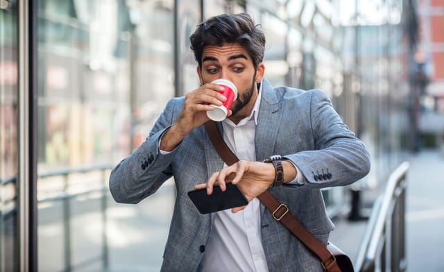Man running late to a meeting.