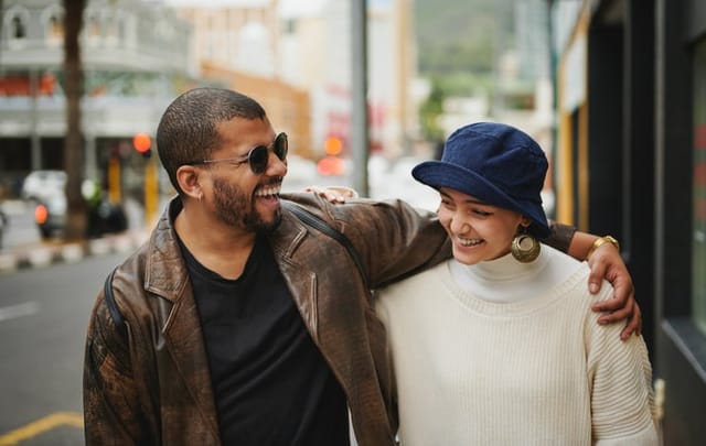 two friends walking down the street