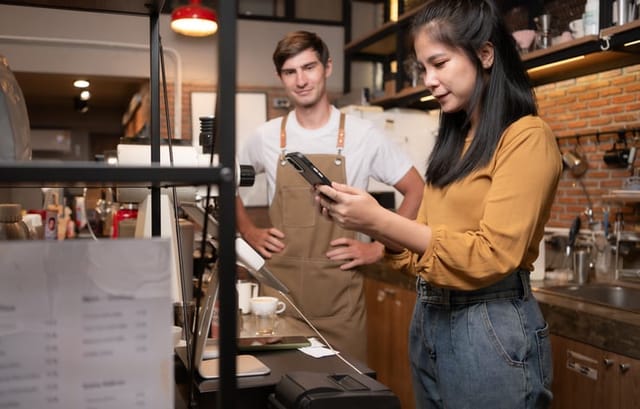 male barista staring at women