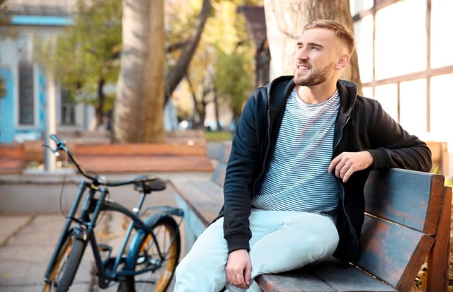 Man sitting on a park bench.