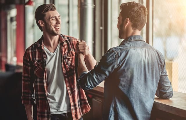 Two men shaking hands.