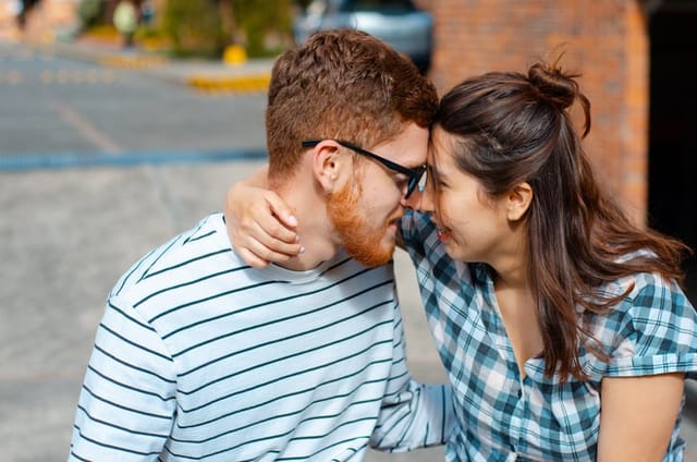 couple nose to nose in sunshine