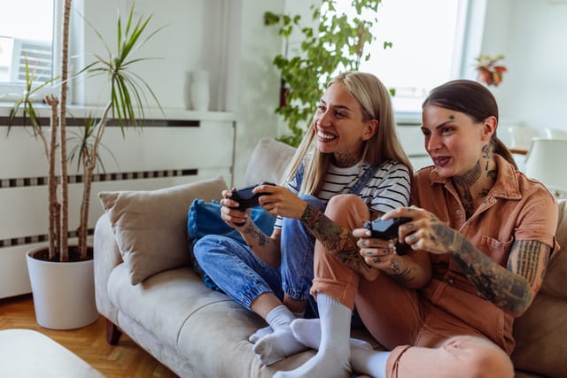 two women playing video games