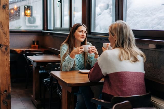 female friends having coffee in cafe