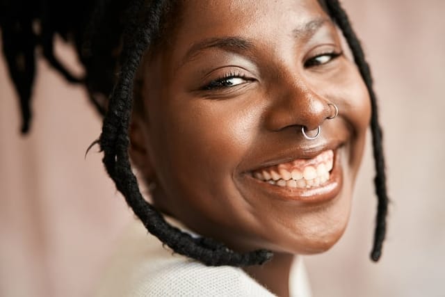 smiling woman with nose ring