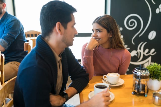 couple flirting at cafe