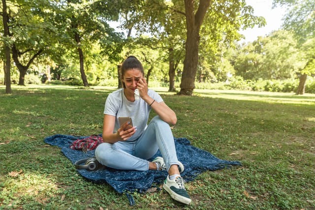 sad woman crying in park
