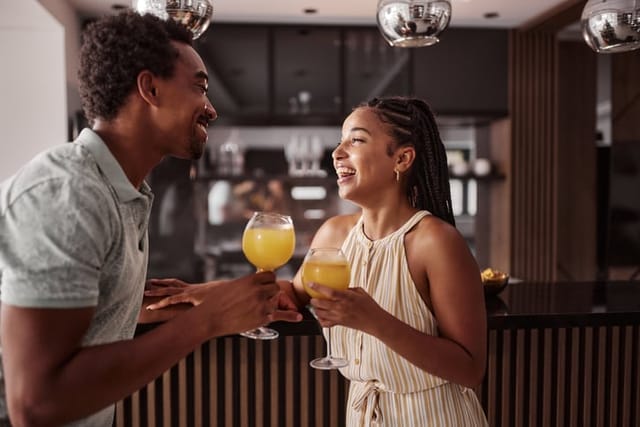 black couple having drinks at bar