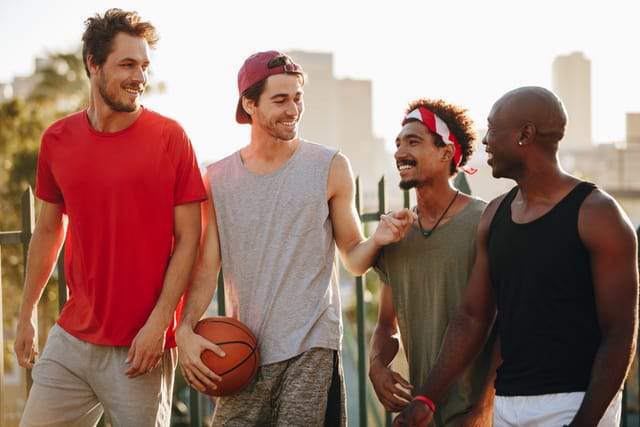 guys playing basketball outside