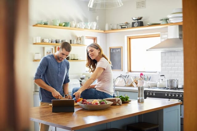 couple cooking in kitchen together