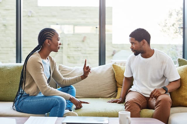 couple arguing on couch