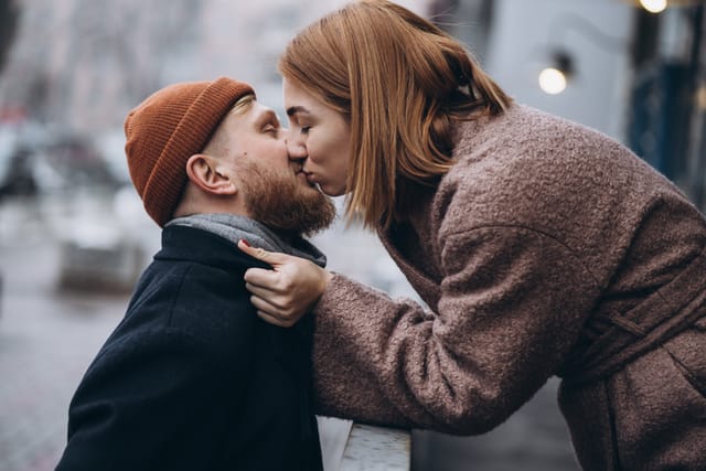 hipster couple kissing in winter