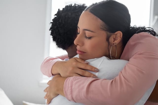 couple hugging at home