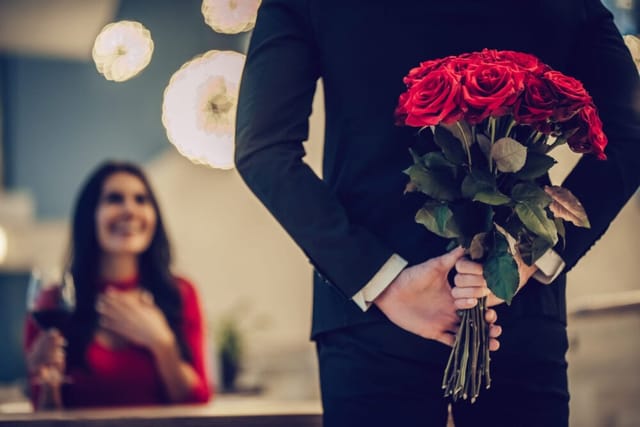 man with roses for woman on valentine's day