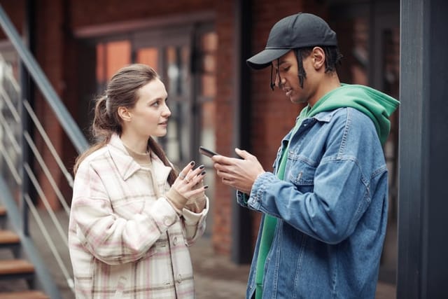 young couple chatting on street