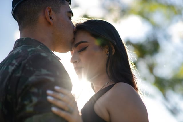 soldier kissing girlfriend on head