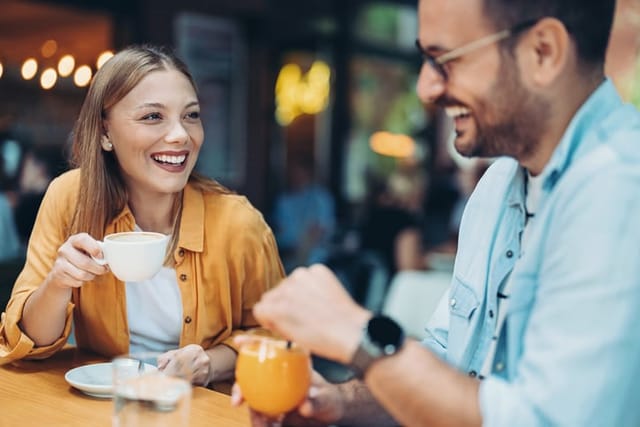 couple flirting at cafe